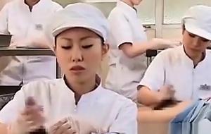 Teen asian nurses rubbing shafts for ball batter medical exam