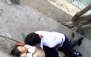 Voyeur tapes asian students having missionary sex in public on the side be incumbent on the river