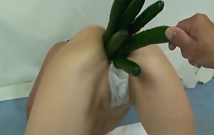 Stuffing her ruined arse with huge fruits and vegetables